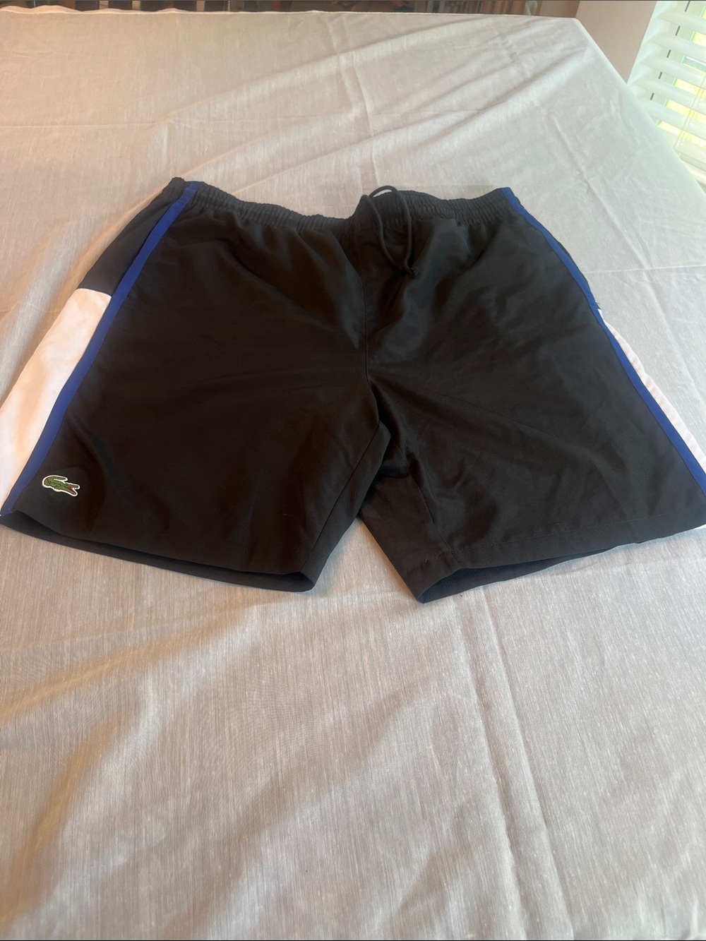 Lacoste Black Athletic Shorts with Blue Trim and White Side Panels